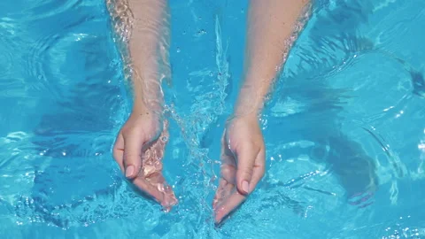 Scooping clean water in slow motion 180fps Stock Footage 93434444