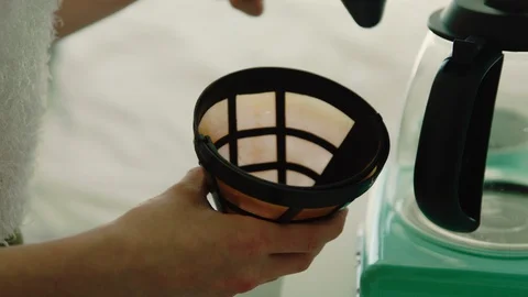 Scooping coffee grounds into container Stock Footage 130089341