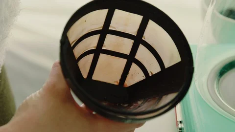 Scooping coffee grounds into container Stock Footage 130089463