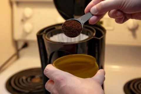 Scooping coffee into pot Stock Photos