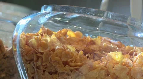 Scooping cornflakes from a glass jar Stock Footage 11930088