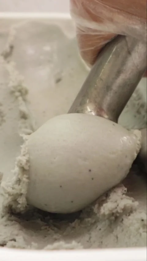 Scooping dark blackberry blackcurrant ice cream sorbet, vertical video Stock Footage 340528044