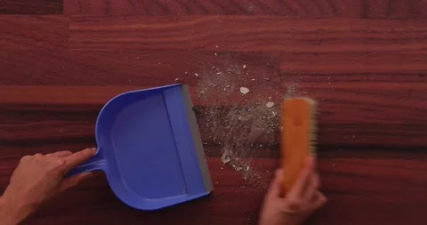 Scooping dirt into a dustpan 1 Stock Footage 132220381