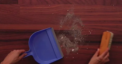 Scooping dirt into a dustpan 2 Video stock 132220368