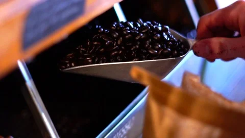 Scooping Express Decaf Coffee Beans in Super Slow Motion Stock Footage 125338743