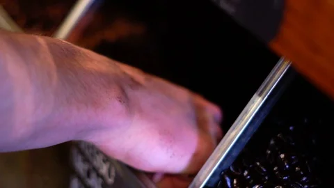 Scooping Express Decaf Coffee Beans in Super Slow Motion Stock Footage 125338748