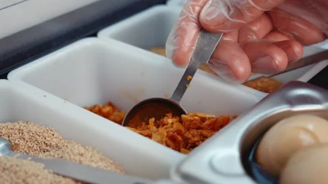 Scooping Fried Onion with Measuring Spoon Video stock 340194169