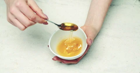 Scooping Honey with Spoon Stock Footage 304881597
