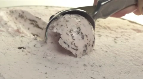 Scooping ice cream out of container Stock Footage 56089354