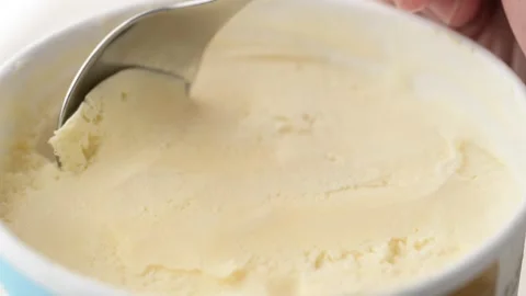 Scooping ice cream with spoon Stock Footage 261342060