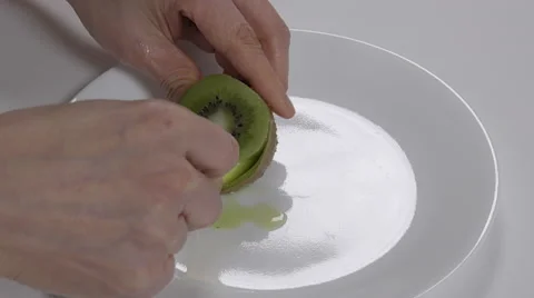 Scooping Kiwi. 4K UHD Stock-Footage 48368452