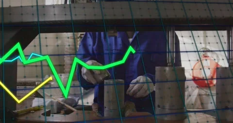 Scooping material into cylinder, tech in blue coverall aligning beneath press Stock Footage 331026987