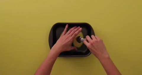 Scooping out the avocado 1 Stock Footage 132149693