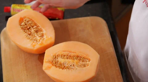 Scooping Out Mango Seeds Stock Footage 27296554