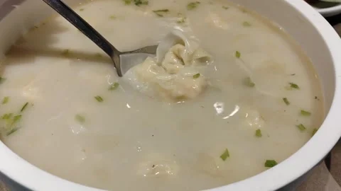 Scooping Puffer Fish Wontons from Soup Close-up, Chinese Cuisine Stock Footage 331613432