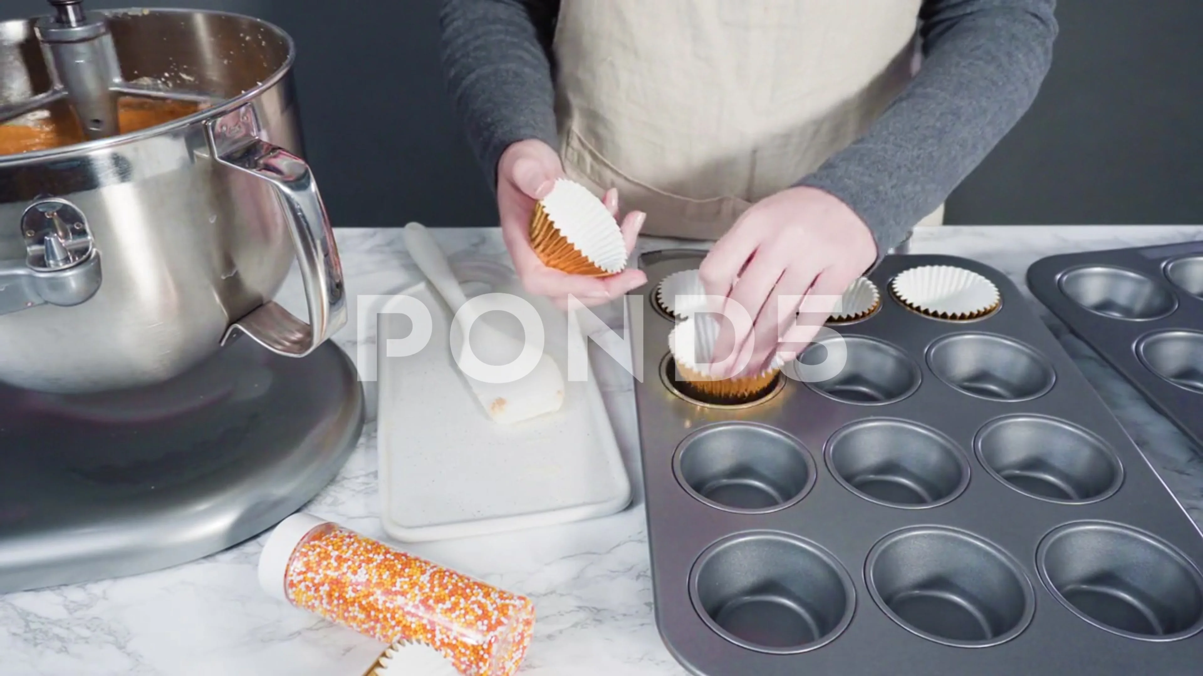 https://images.pond5.com/scooping-pumpkin-spice-cupcake-batter-footage-169536848_prevstill.jpeg
