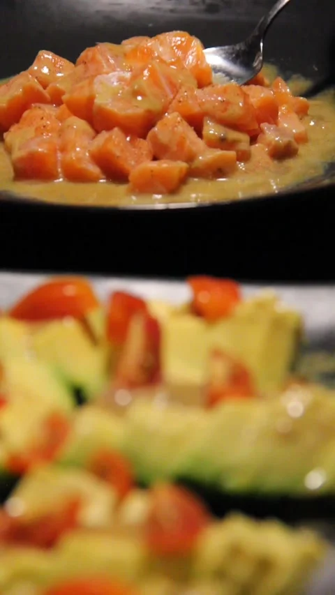 Scooping salmon dinner salad foreground vertical 스톡 동영상 322740338