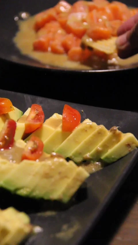 Scooping salmon taking avocado chips diagonal vertical aperitivo 스톡 동영상 322740339