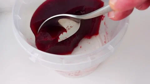 Scooping Smooth Red Jelly – Close-Up Texture Delight Video stock 309177516