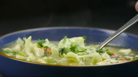 Scooping some soup with spoon Stock Footage 61326928