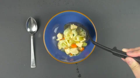 Scooping soup into bowl Video stock 61325812