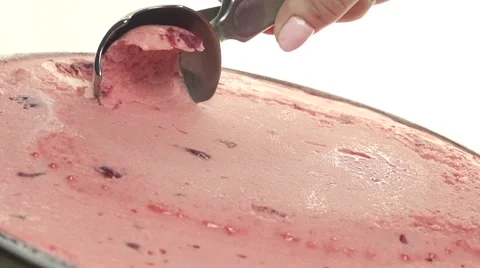 Scooping strawberry flavoured ice cream Stock Footage 56089184