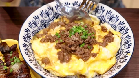 Scooping Thai Beef and Egg Rice with Spoon and Fork Stock Footage 315083049