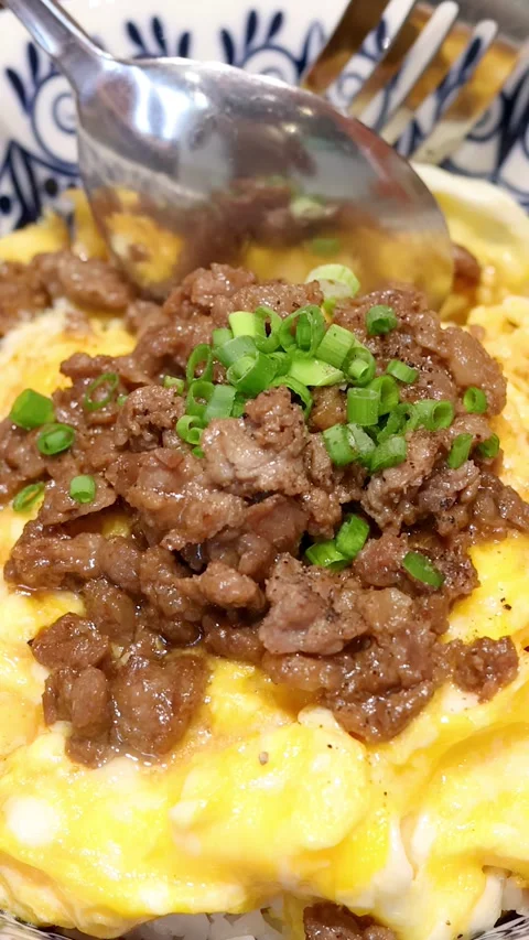 Scooping Thai Beef and Egg Rice with Spoon and Fork Stock Footage 315726081