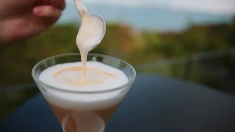 Scooping Thick Foam Of A Delicious Hot Coffee Latte With A Spoon In A Glass Stock Footage 232656896