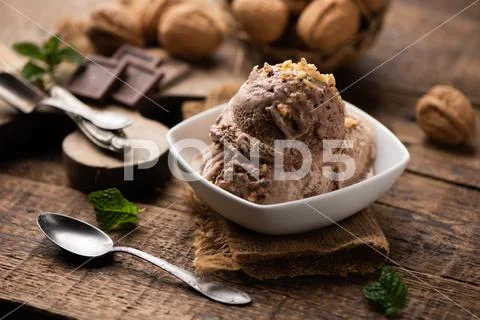 Scoops of Chocolate and Vanilla Ice Cream on Plate Stock Photos
