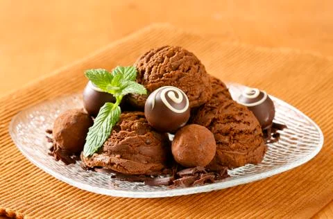 Scoops of chocolate ice cream and truffles Stock Photos