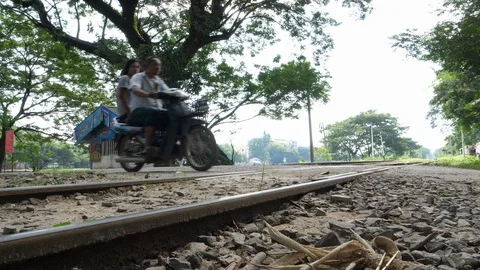Scoote cross a railway in Shan State in Myanmar, Burma, Asia in 4K Stock Footage 94875275