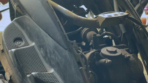Scooter engine bay and mechanical components closeup in workshop Stock Footage 344115837