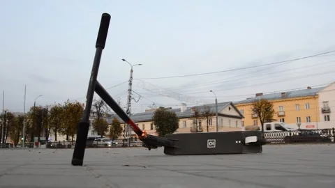 Scooter lies on the square Stock Footage 280349758