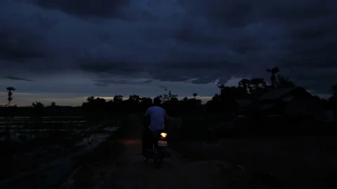 Scooter passing by in night Stock Footage 76552925