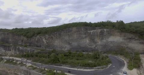 Scooter riding on cliff road Stock-Footage 71828131