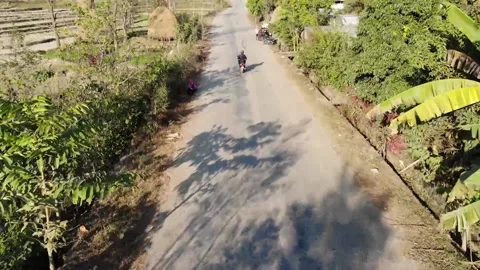 Scooter running on road. Stockbeeldmateriaal 170883097