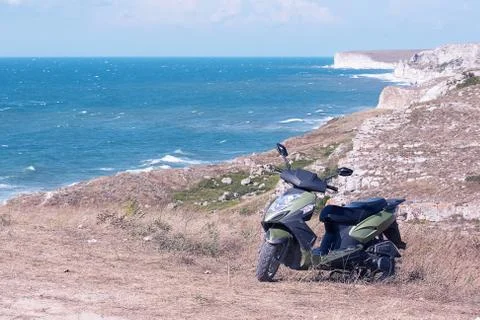 Scooter on the seashore Stock Photos