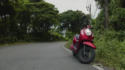 Scooter stands on the side of the road in the middle of the jungle,Phuket Stock Footage 223822815