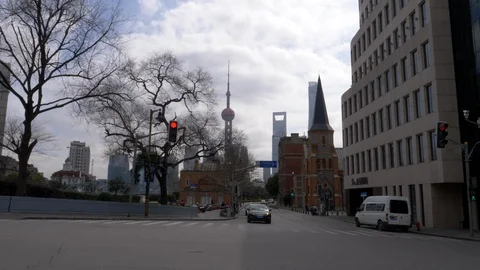 Scooters Drive thru the intersection with Shanghai Pearl Tower in background Stock Footage 122990089
