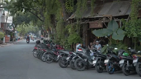 Scooters Lined Up Outside Café in Ho Chi Minh – Feb 26 Stock Footage 303045582