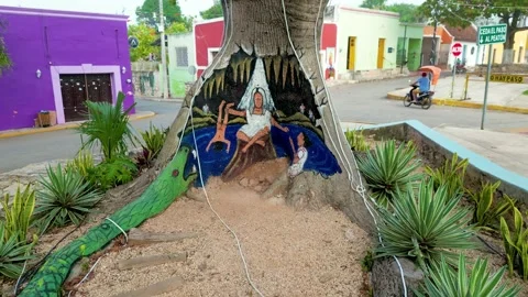 Scooters pass the tree of legends in mani yuc pueblo magico Stock Footage 237939640
