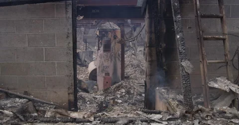 Scorched water heater seen through a doorway in the basement of a house Stock Footage 59515544