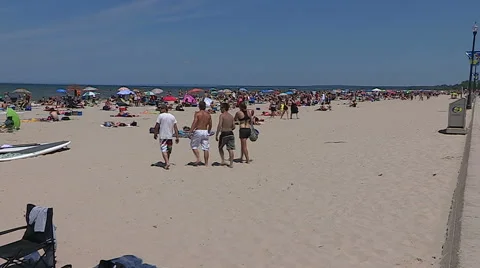 Scorching hot summer beach scenes on sand and water at Wasaga beach Canada Stock Footage 58516705