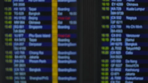 Scoreboard with changing information is in interior of international airport in Stock Footage 123073858