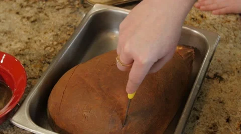 Scoring the Christmas Ham Video stock 64185268