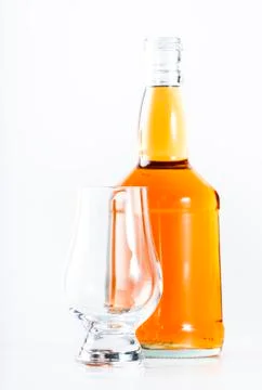 Scotch Whiskey without ice empty glass, white background, copy space Stock Photos