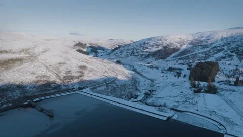 Scotland Drone Shot of Upper Glendevon Reservoir winter. Dam and sledges Stock Footage 146567072