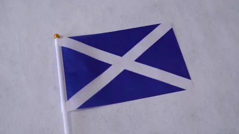 Scotland flag close up on white background. Scottish national flag. Video stock 330991184