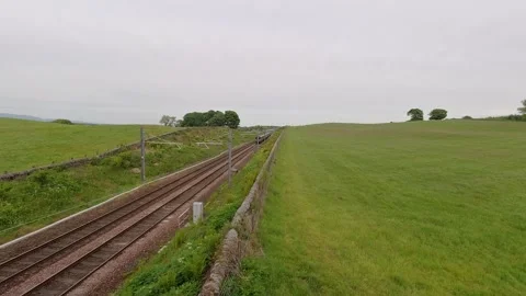 A Scotrail express passenger train on the Glasgow to Edinburgh line. Stock Footage 309958464